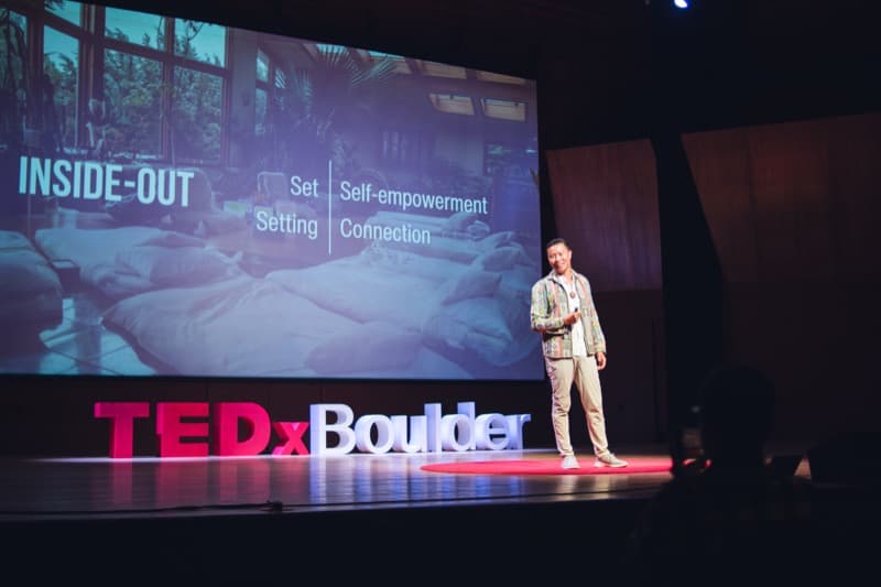 Austin Mao speaking on stage at TEDx Boulder 2024