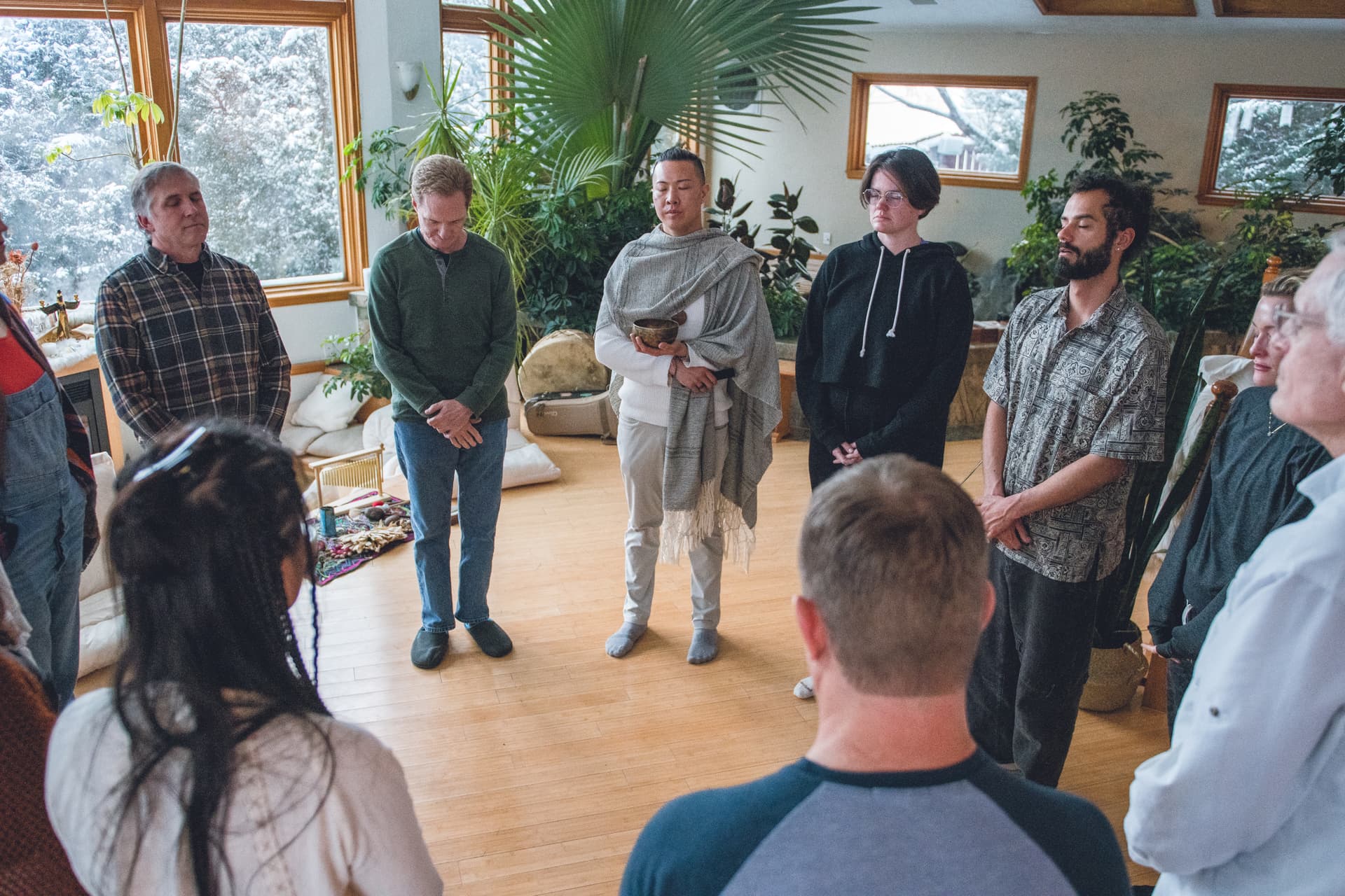 Retreat participants standing together in the main gathering room