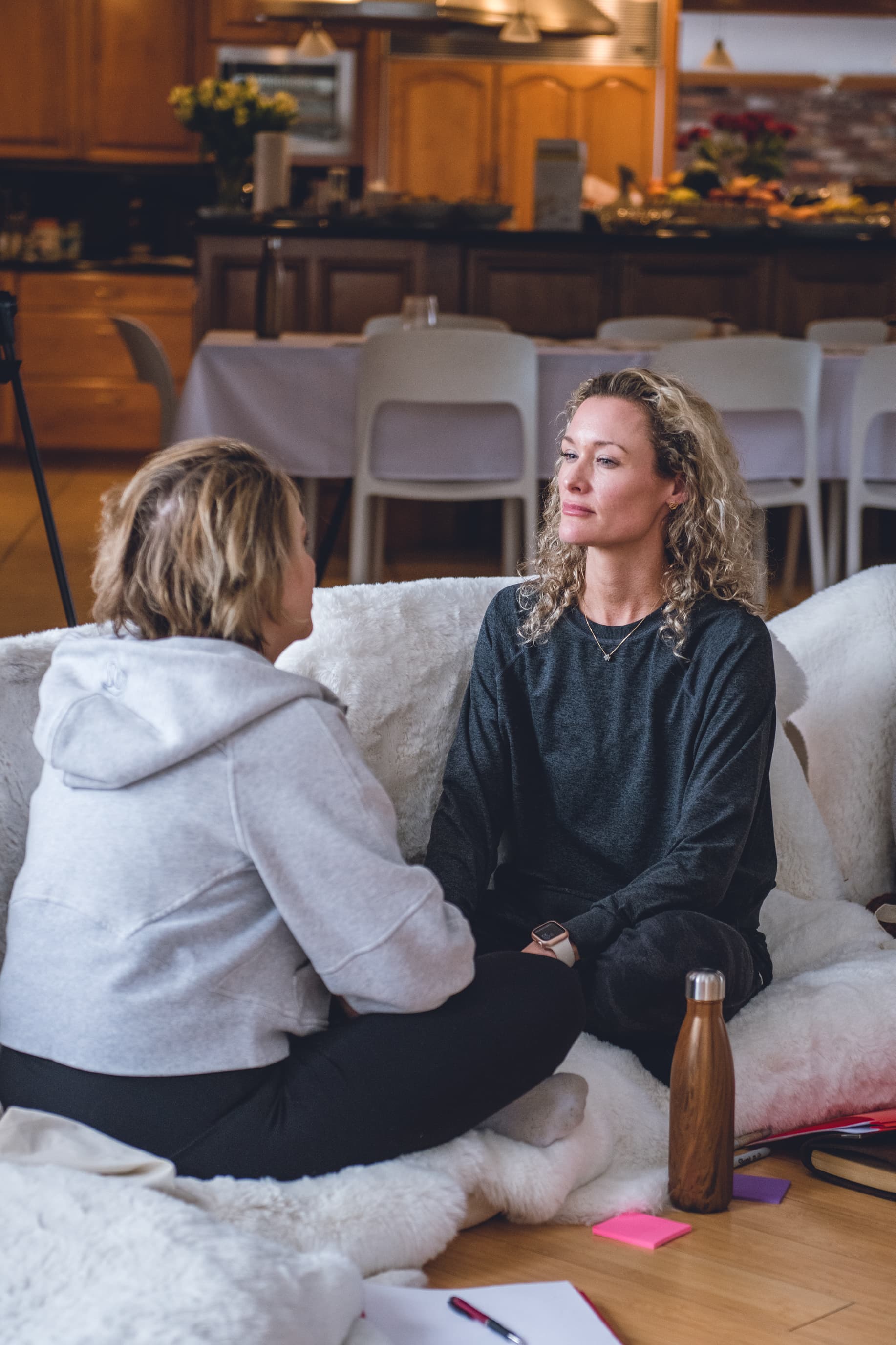 A participant sitting quietly at home before the retreat begins