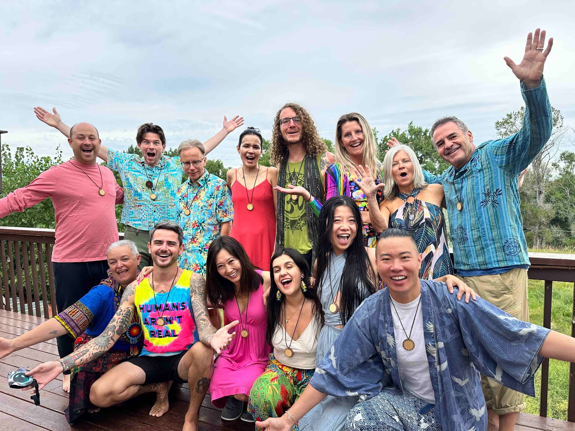Ceremonia retreat alumni celebrating together on an outdoor deck